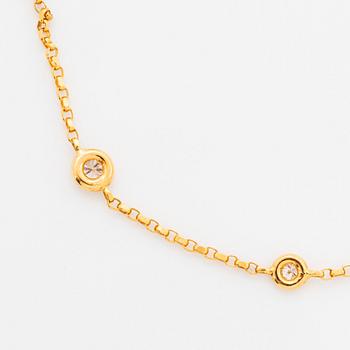 Collier 18K guld med runda briljantslipade diamanter.