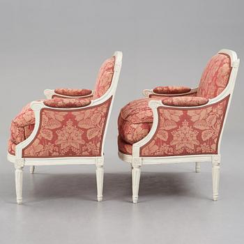 A pair of Louis XVI late 18th Century armchairs by M. dela Porte (Paris 1765-1784).