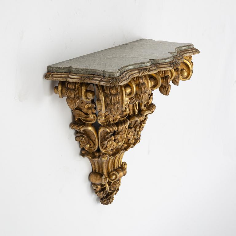 A gilt stone top table, 19th Century.