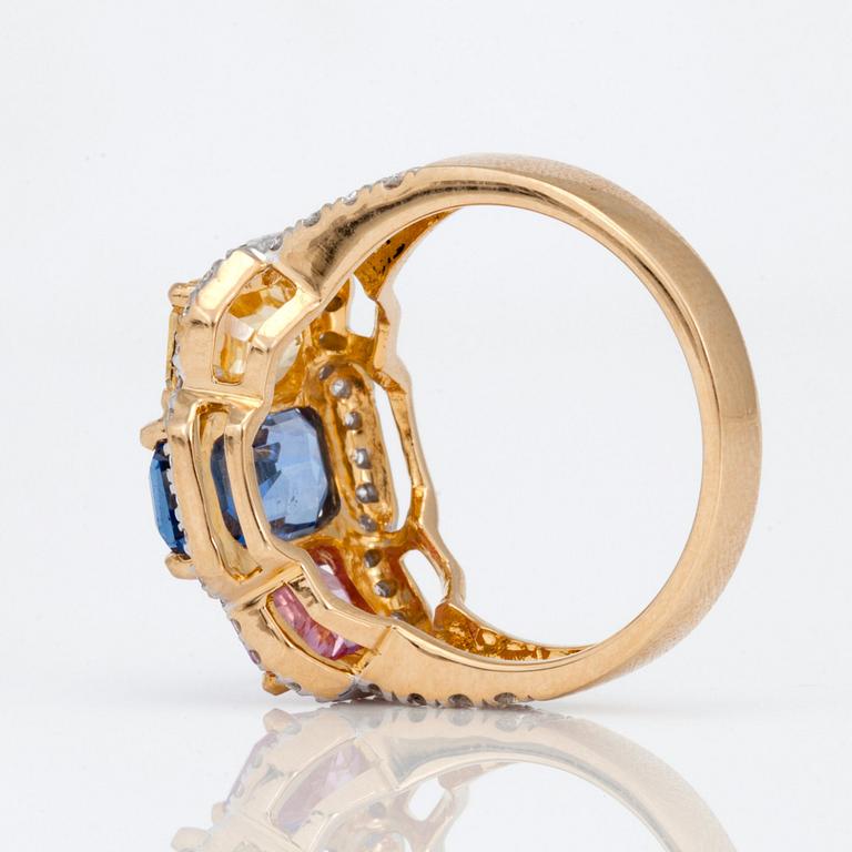 A 5.87 ct blue, pink and yellow sapphire and 0.76ct diamond ring.