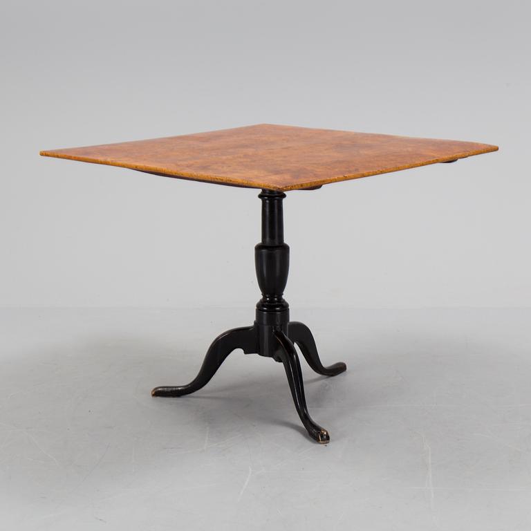 An burr alder veneered folding table, circa 1800.