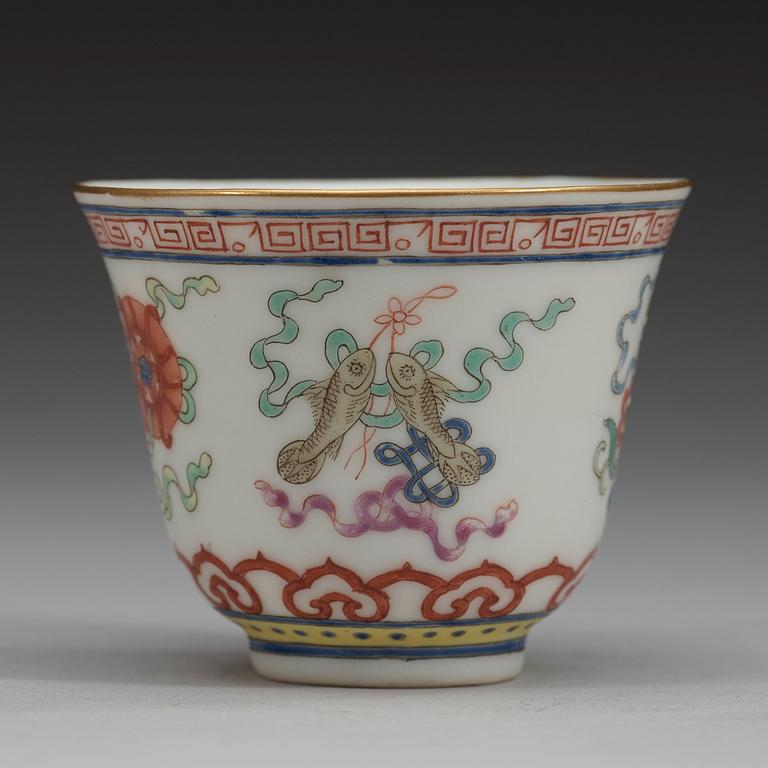 A set of eleven famille rose ba jixiang wine cups, Qing dynasty, with Guangxu six character mark and period (1874-1908).