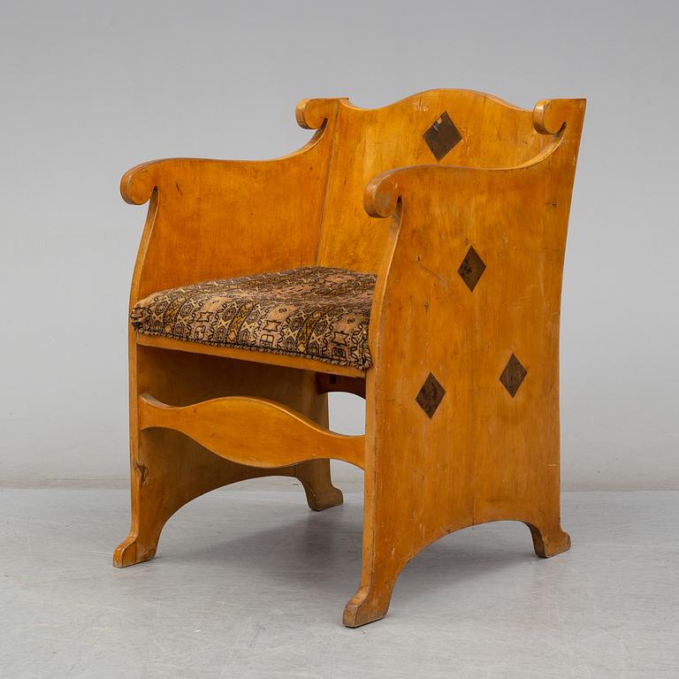 An early 20th century birch armchair.