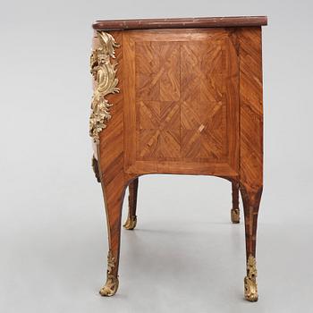 A Louis XV kingwood parquetry and ormolu-mounted commode in the manner of Jacques-Philippe Carel (Paris, 1723-1760).