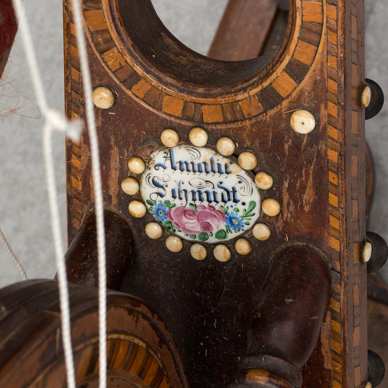 A 19th century spinning wheel.