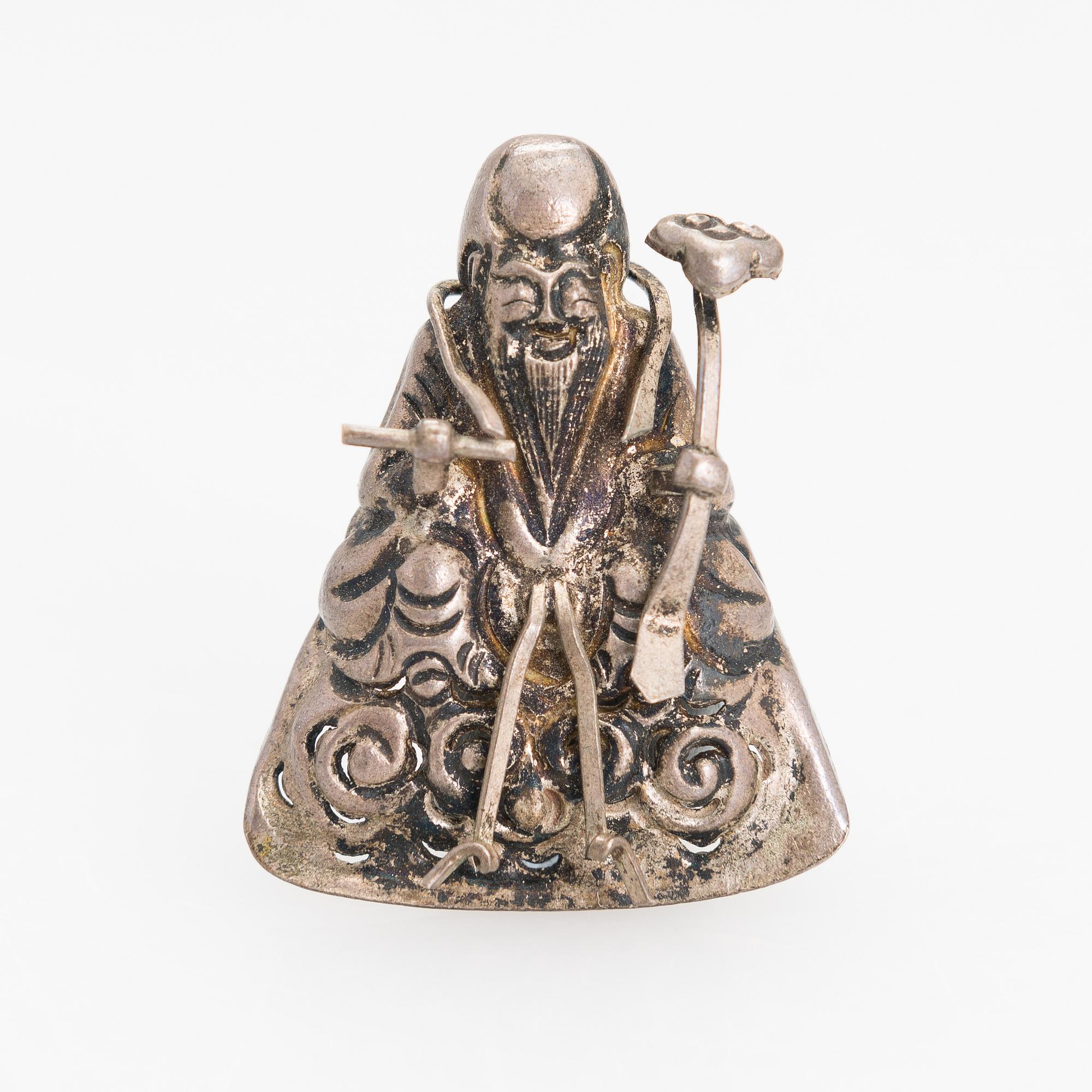 A silver figurine. China early 20th century.