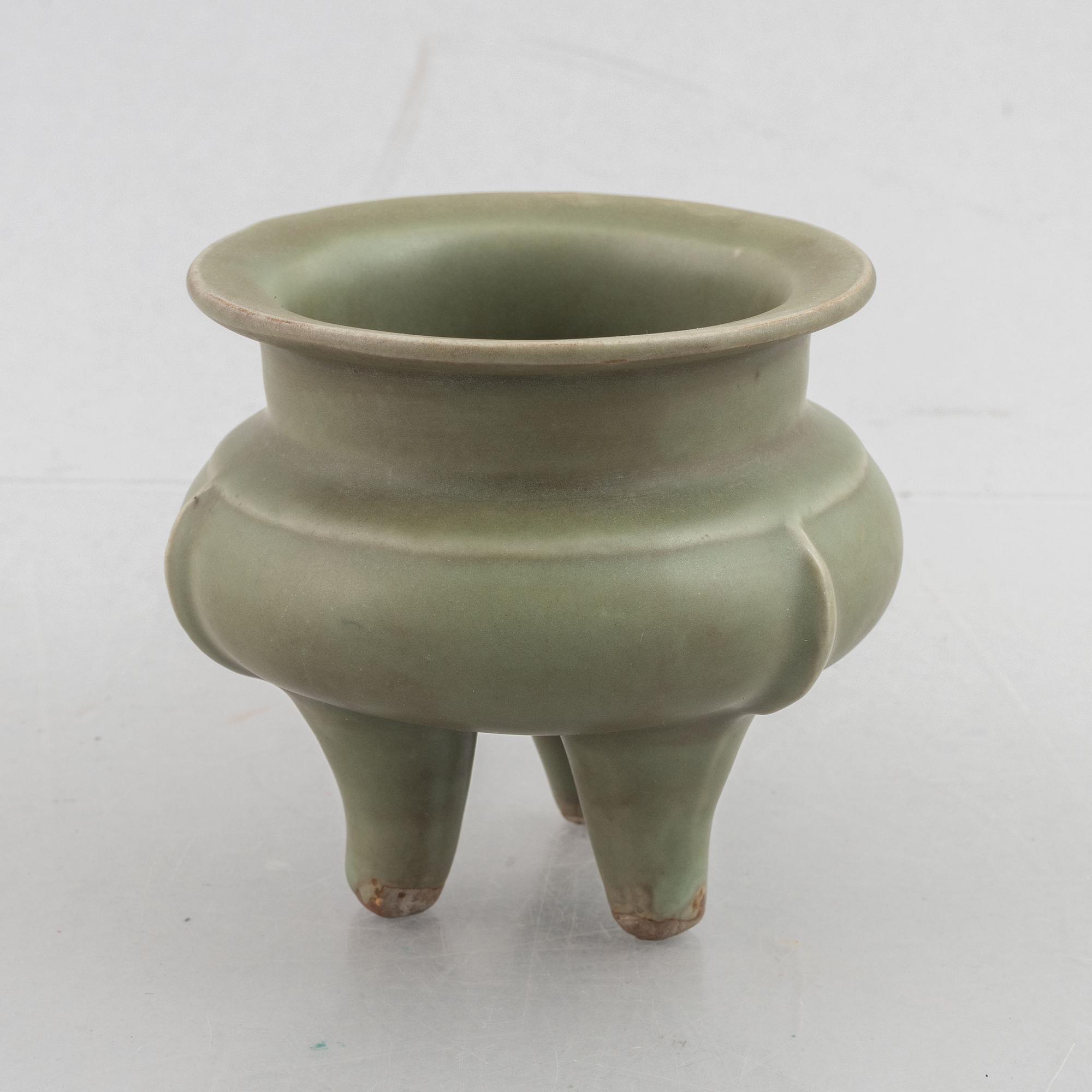 A Chinese celadon tripod censer, late Ming dynasty, for the Southeastern market.