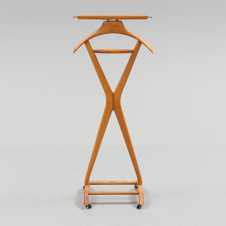 A late 20th century Fratelli Reguitti stand for men's clothes.