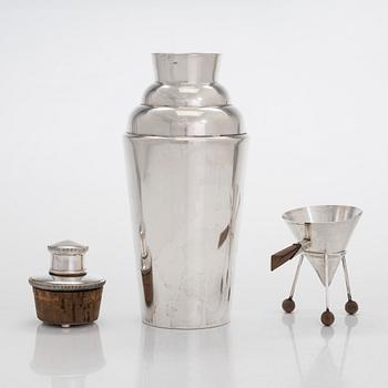 Measuring cup, champagne whisk, and cocktail shaker, silver and silver plated, 1950s/60s.