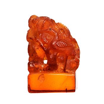 168. An amber sculpturein the shape of a fawn and a bird amongst pine trees, Qing dynasty (1644-1912).