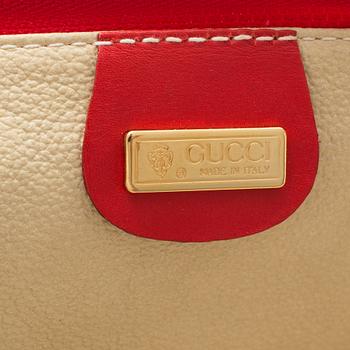 GUCCI, a 'Flora' garment bag.