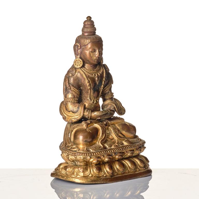 A gilt copper alloy figure of Amitayus, Tibeto-Chinese/Mongolia, 18th century.