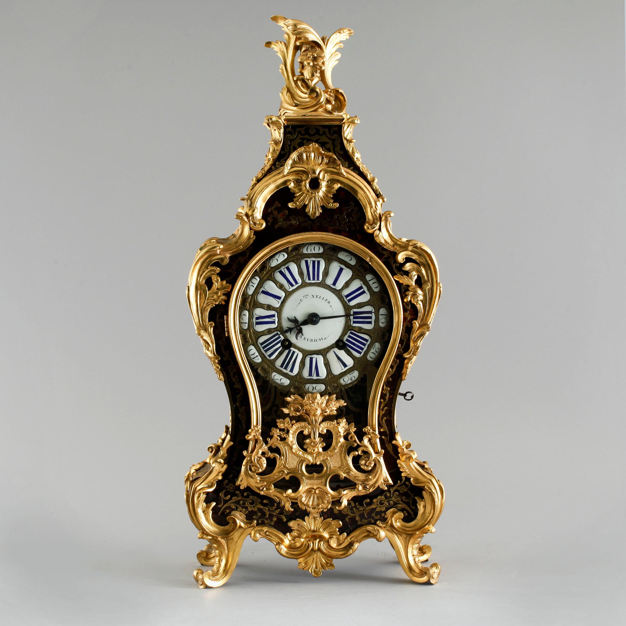 A 19th century mantle clock in the style of Louis XV.