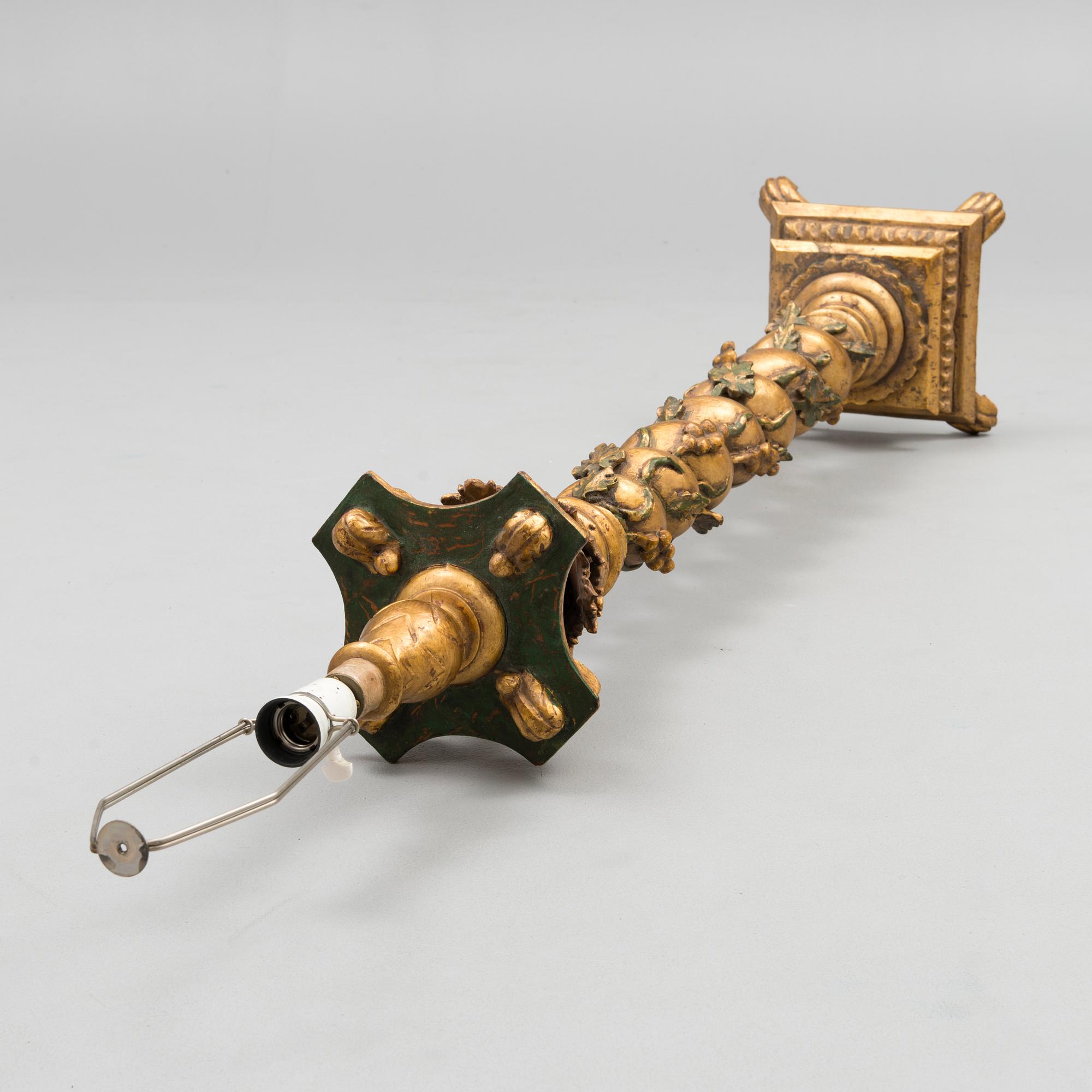 A Baroque style 1920s standard lamp.