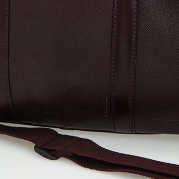 Louis Vuitton, a 'Taiga Kendall PM' weekend bag.