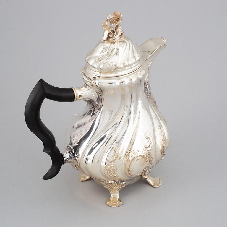 CG Hallberg, a silver coffee pot, creamer and sugar bowl, Stockholm 1956-57.