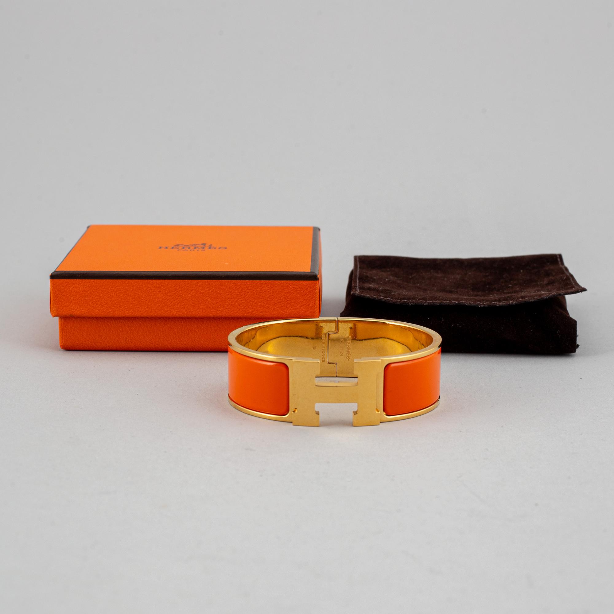 HERMÈS, a 'Clic H' bangle.