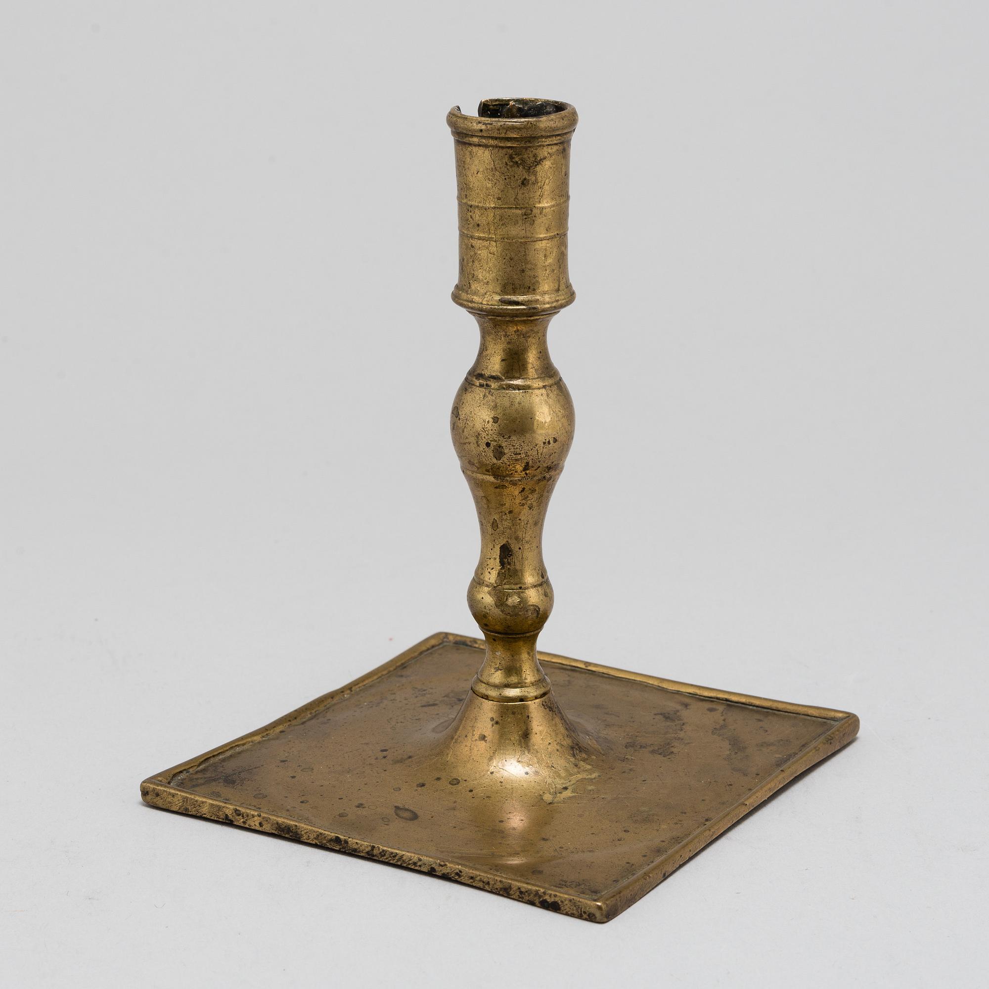 A Baroque brass candlestick, early 18th century.