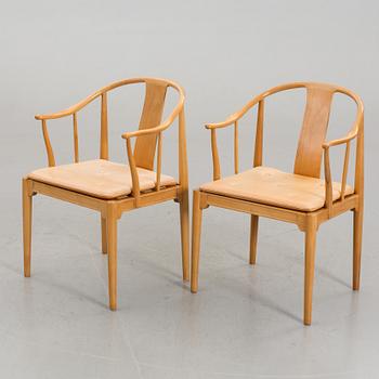 HANS J WEGNER, a pair of armchairs "Kinastolen" Denmark later part of the 20th century.