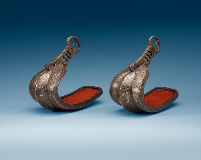 A pair of Japanese silvered bronze stirrups, Meiji (1868-1912).