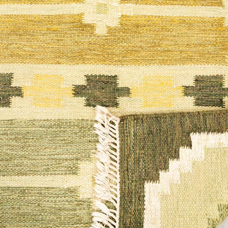 Flat-weave rug signed SH, approximately 194x133 cm.