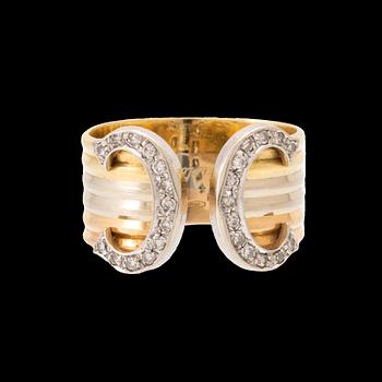 A Cartier "Double C" ring 18K tricolor gold set with round single-cut diamonds.