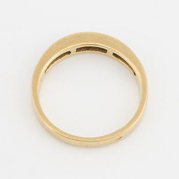 Step-cut diamond ring.