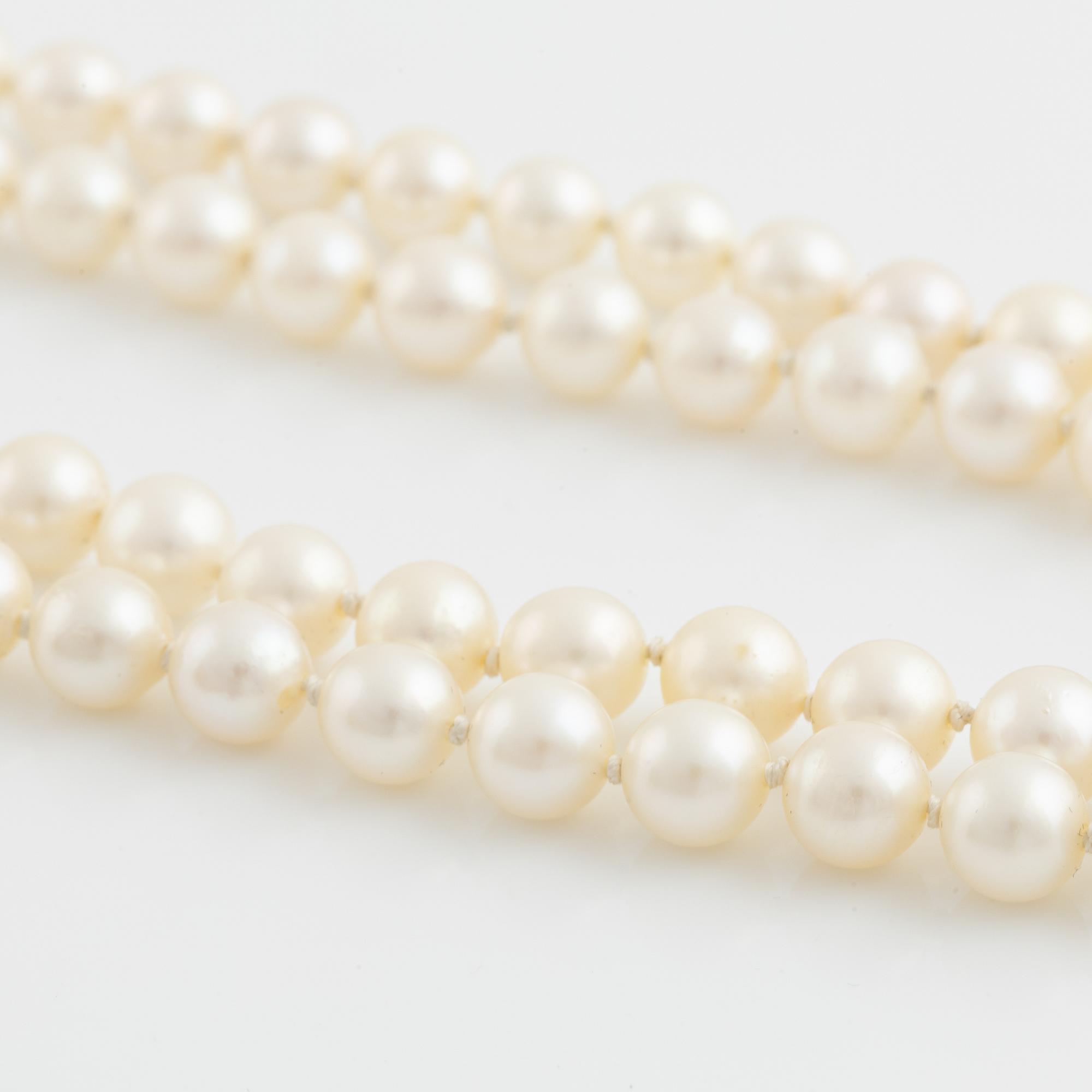 Cultured two strand pearl necklace, clasp silver with paste.