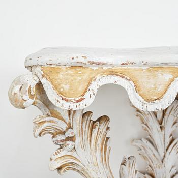 A pair of French Louis XVI-style consoles, late 19th century.
