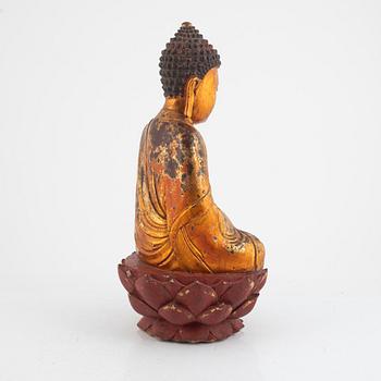 A gilt and lacquered figure of a seated buddha, Vietnam, 1800-tal.