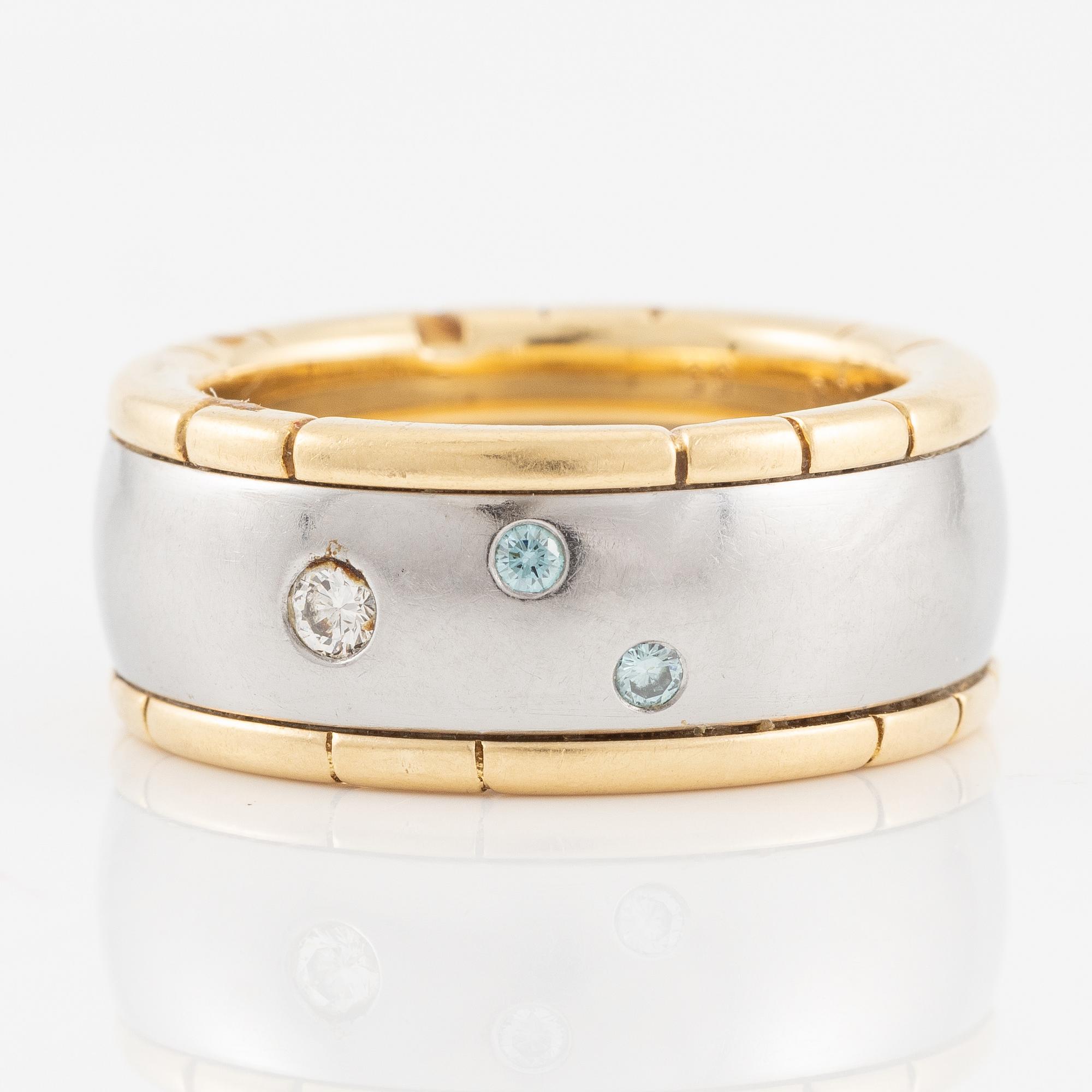 Ring 18K guld och stål med runda briljantslipade diamanter, Darsy.