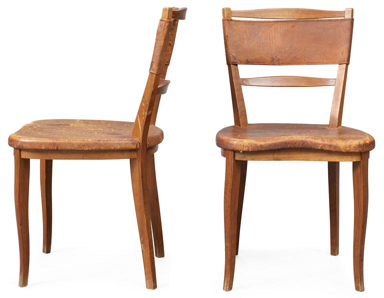 A pair of Carl-Axel Acking mahogany and brown leather chairs, Svenska Möbelfabrikerna Bodafors.