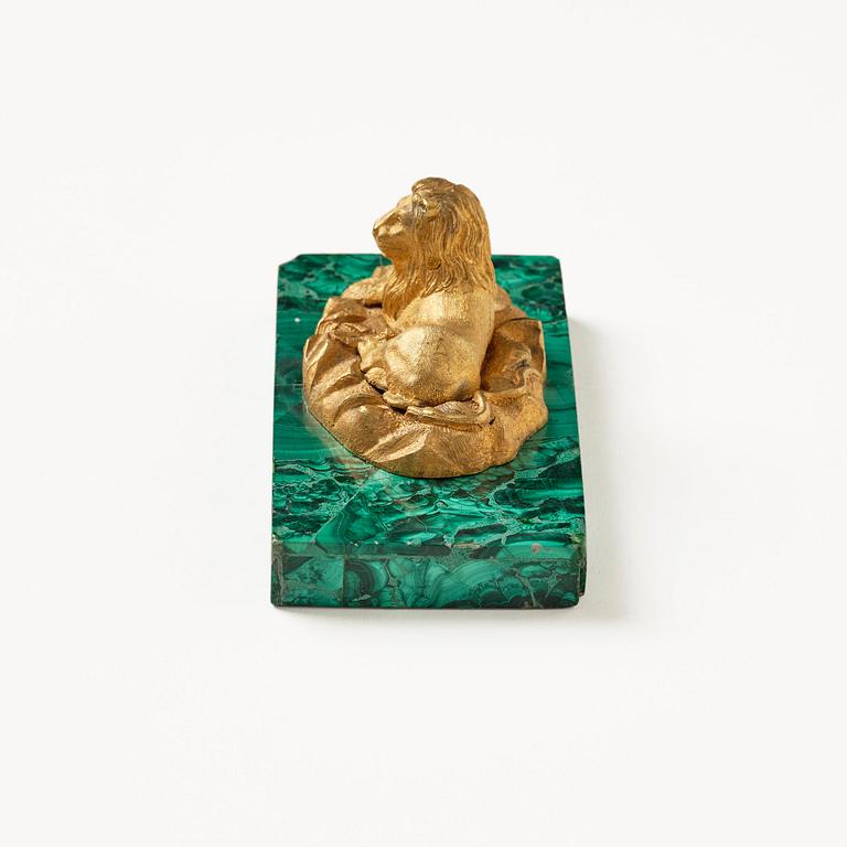 A Russian Nicholas II malachite-veneered and gilt-bronze paperweight, late 19th century.