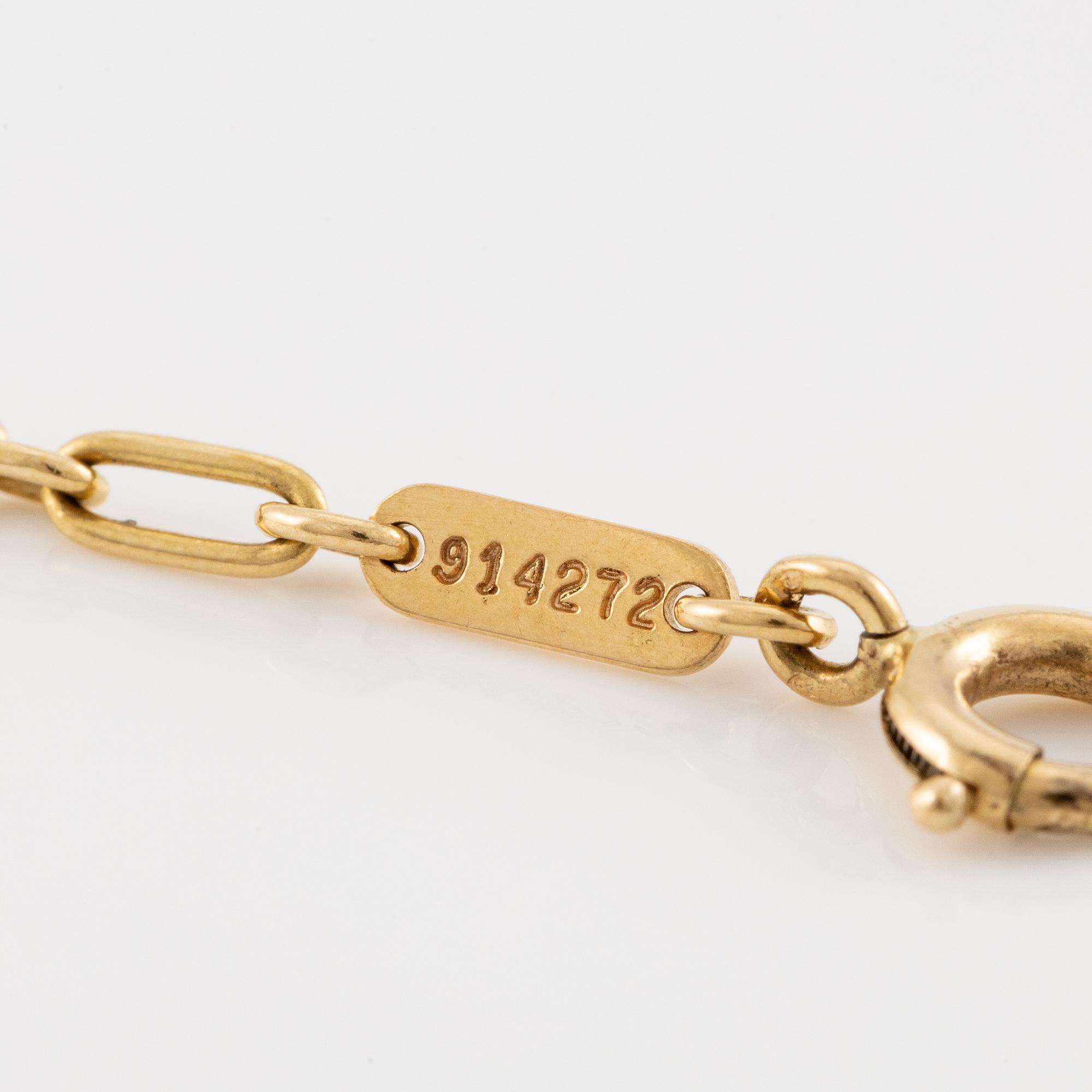 A Cartier necklace 18K multi-coloured gold "Trinity" cross.