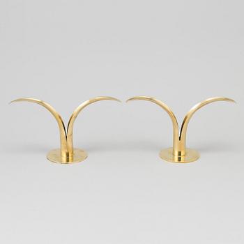 Two pair of 'Liljan' brass candlesticks by Ivar Ålenius-Björk, Ystad Metall, second part of the 20th century.