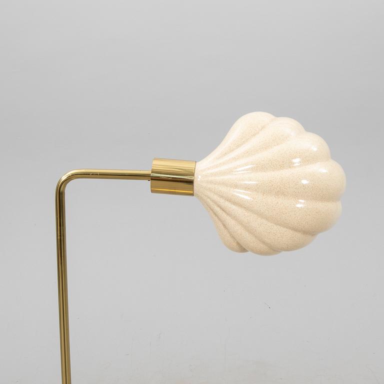 A late 20th Century floor lampp with a shell formed shade.