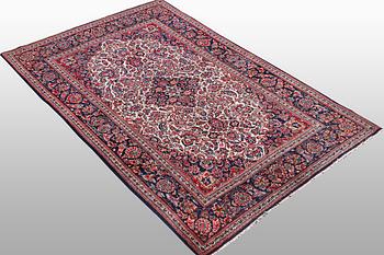 A rug, semi-antique Keshan, 217 x 134 cm.