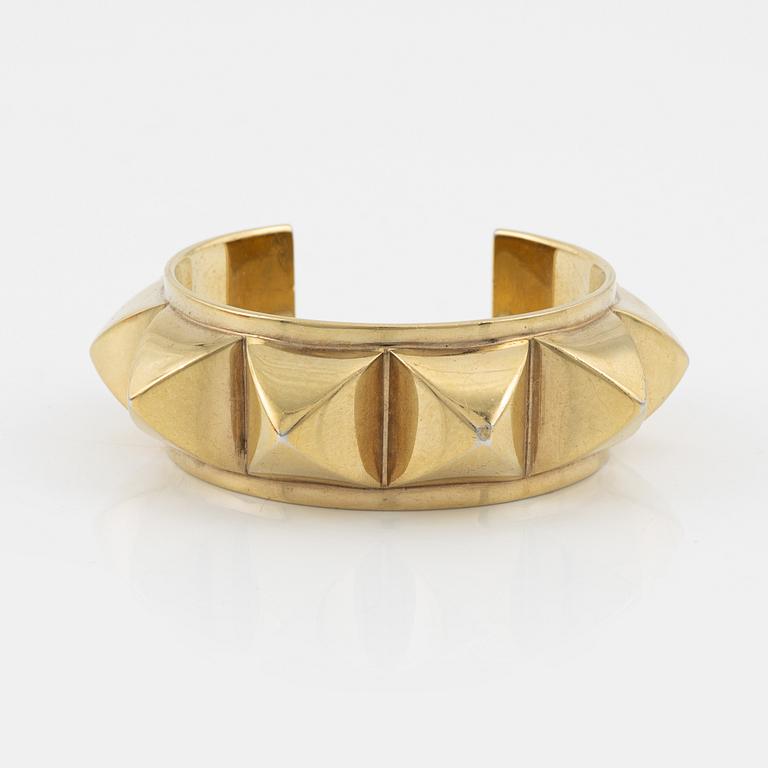 Hermès, a vintage gold tone stud bangle.