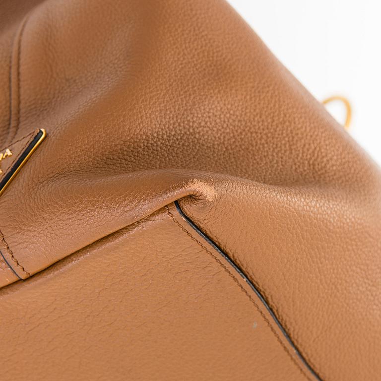 Prada, a "Vitello Phenix" leather bag.