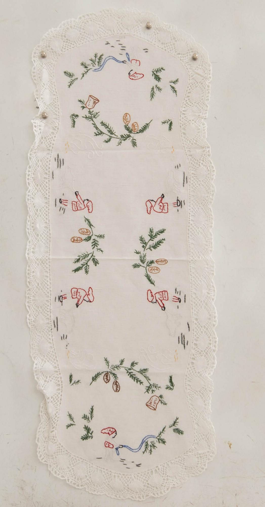 A collection of smaller Christmas tablecloths, runners, and wall hangings, approximately 34 pieces, mid/second half of the 20th century.