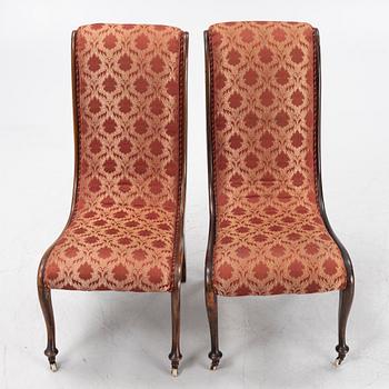 A pair av easy chairs, 19th Century.