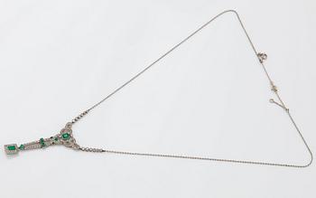 A platinum necklace set with faceted emeralds and old- and eight-cut diamonds.