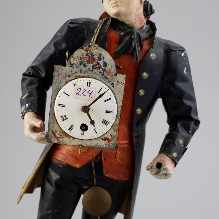 A Black Forest sheet metal figural timepiece, second half of the 19th century.