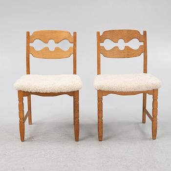 Henning Kjærnulf, a set of six oak 'razorblade' chairs, with new sheepskin upholstery, for EGK, 1960s.