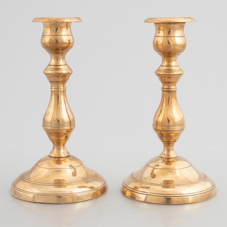 Skultuna Messinsbruk, two pairs of brass candlesticks, 19th century.