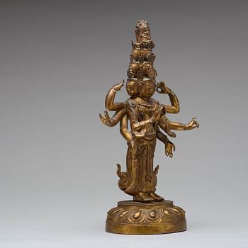 A Tibeto-Chinese gilt bronze figure of eleven-headed Avalokiteshvara, 19th Century.