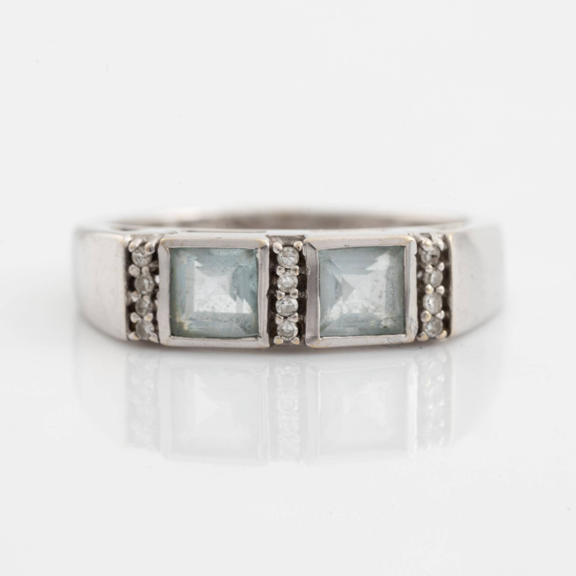 Ring, pendant, and a pair of earrings, 18K white gold with topaz and small diamonds.