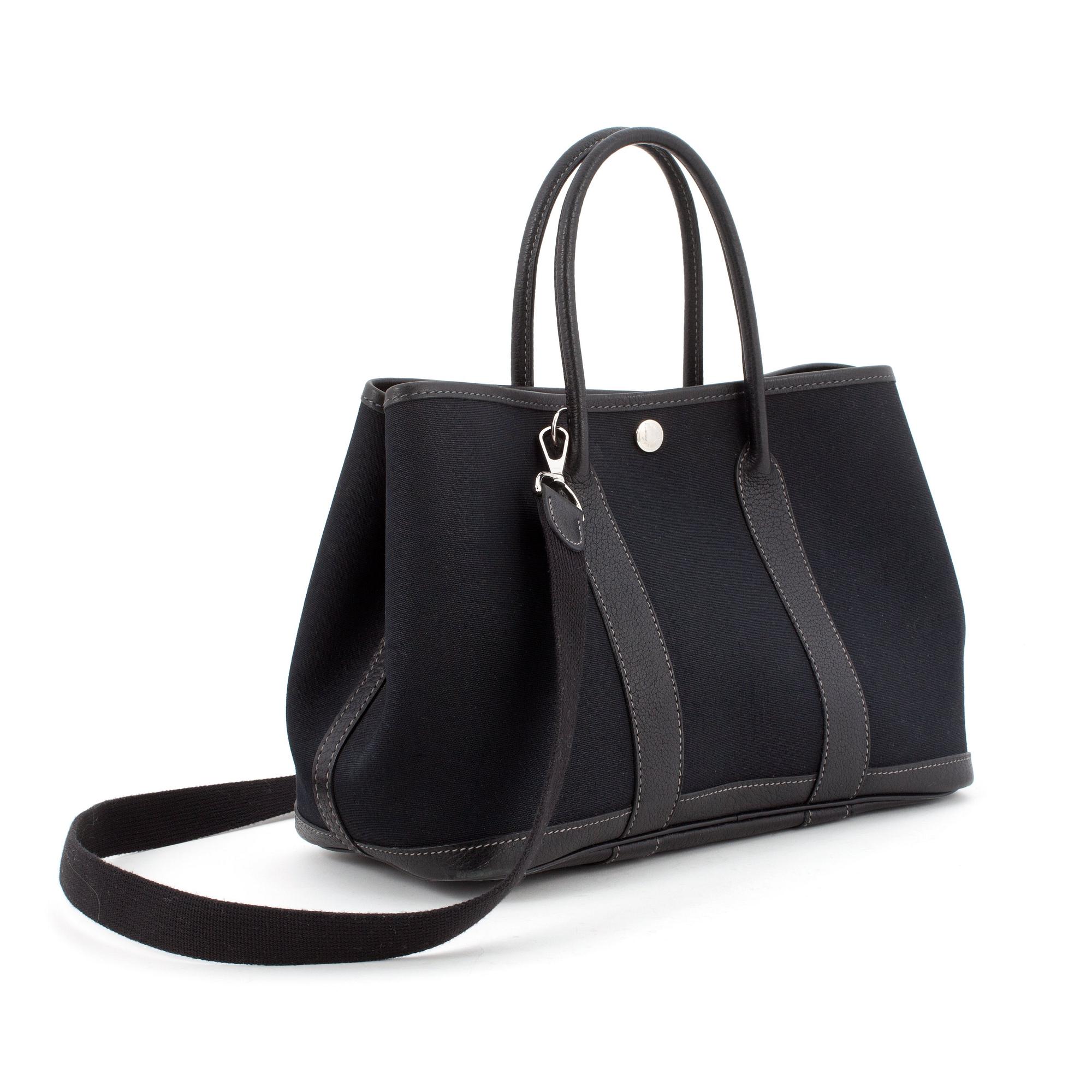 HERMÈS, a black canvas and leather bag, "Garden Party".