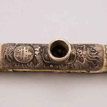 A bone, metal and wood opium pipe, probably China, circa 1900.