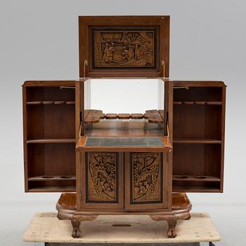 a chinese style bar cabinet from the late 20th century.